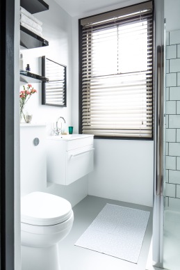 The bath was removed and a shower installed instead with a light and contemporary monochrome scheme