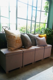 Upholstered storage stools with an array of new cushions